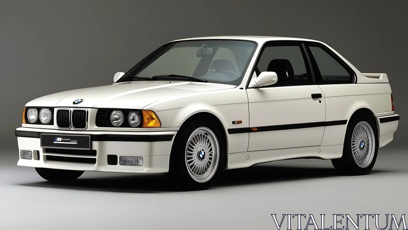 White BMW E36 coupe studio profile with neutral backdrop.