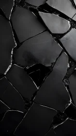 Deep black shattered tiles create bold abstract drama
