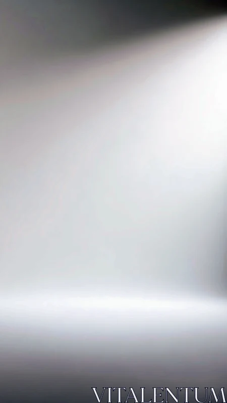 Soft gradient light beam cuts across minimal grey field