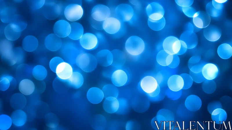 Blue bokeh abstract background with glowing circular light effects.