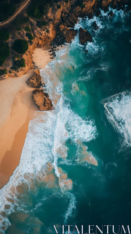 Crashing turquoise surf along rugged golden coastline aerial.