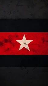 Weathered red and black flag with central white star.