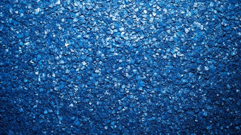Granular blue stone texture shows dense reflective surface coverage