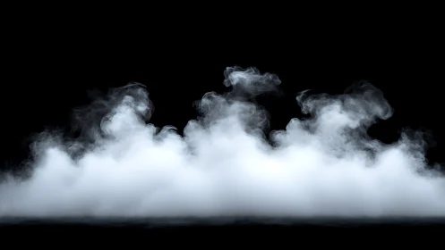 Rolling white mist gently drifts across a deep black stage