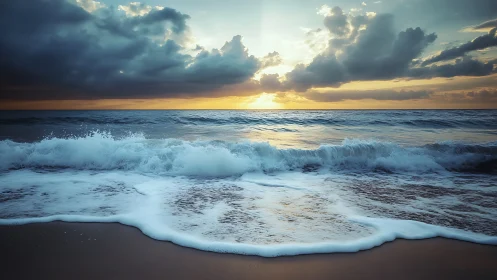 Ocean shoreline shows breaking waves under dramatic sunset sky