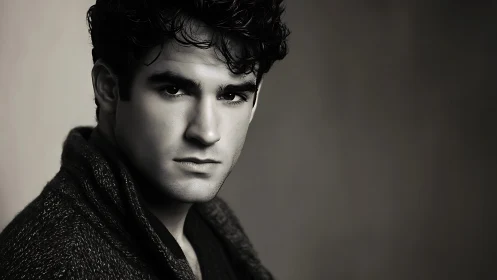 Storm-eyed portrait studies quiet strength in soft grayscale light