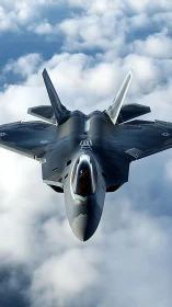 Stealth fighter jet cutting through layered cloud canopy.