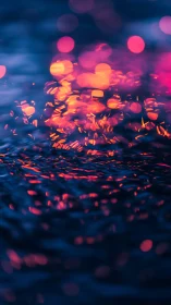 Neon bokeh lights glowing over dark rippled water surface.