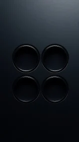 Four Metallic Circular Apertures Arranged in Grid Formation on Dark Surface