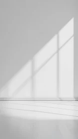 Rectilinear window projection across minimal white interior wall.