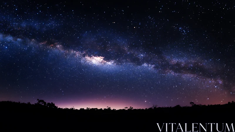 Milky Way galactic core over silhouetted horizon at twilight