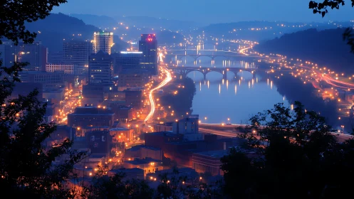 Urban riverfront cityscape with bridges at dusk viewed afar.