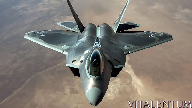 Stealth tactical fighter jet over arid desert terrain in flight