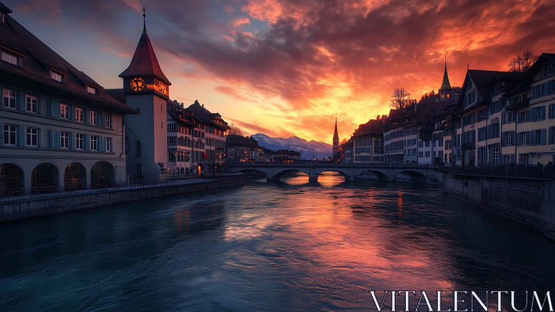 European riverside town under intense sunset sky at dusk.