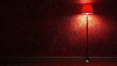 Red floor lamp illuminates textured wall in controlled scene