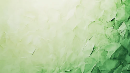 Soft green crumpled paper texture with gradient light.
