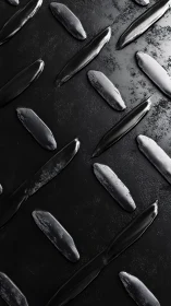 Glossy black strokes in a calm, softly lit abstract pattern.