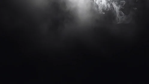 Soft white smoke drifts across deep black darkness.