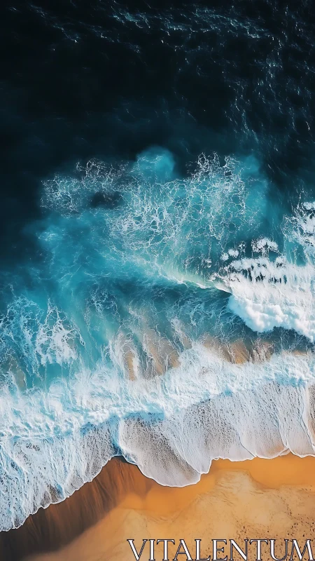 Aerial ocean surf breaking over golden sand shoreline.