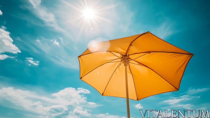 Golden beach umbrella glows under a vivid summer sky