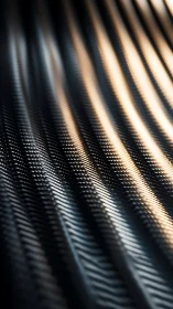 Curved metallic ridges show repeating micro texture in closeup