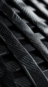 Macro closeup of interlaced carbon fiber composite slats