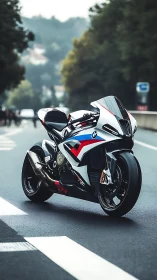 Sleek BMW sport bike waits on a calm tree lined roadway
