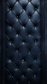 Midnight quilted leather wall with soft reflective sheen.