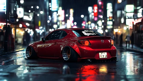 Stanced red Mazda glows on neon-soaked rainy city street.