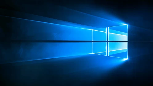 Glowing blue window logo casts sharp reflections in dark space