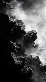 Misty volcanic cliffs wrapped in dramatic swirling light.