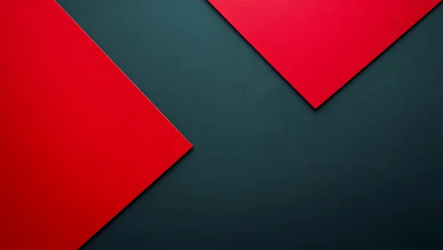 Red geometric panels on dark textured background surface.