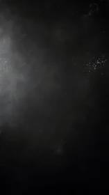 Low-key textured vignette with diffuse luminance gradient field.