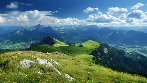 Mountain ridgeline with green meadows under clouded sky.