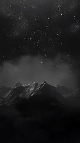 Midnight peaks resting beneath a soft, star-sown sky.