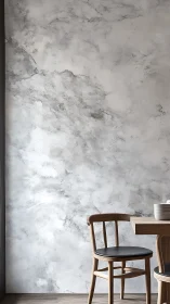 Calm dining corner against soft cloudlike marble wall.