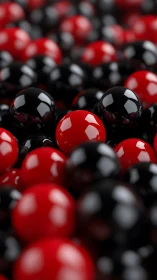 Red and black glossy spheres in shallow depth of field.