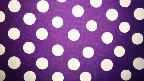 Bold white polka dots on rich purple textured background.