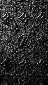 High-contrast macro of embossed monogram on black leather