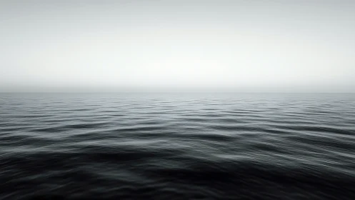 Endless calm ocean stretches softly into a quiet horizon