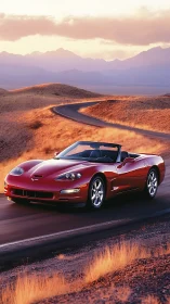 Red convertible cuts through golden desert curves at sunset.