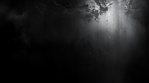 Soft light on textured dark wall inviting quiet reflection.