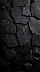 Photorealistic dark slate wall with fractured geometric tiling.