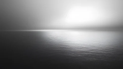 Soft horizon hush over silver water and infinite quiet sea.