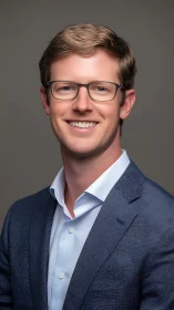 Photorealistic corporate headshot in soft studio lighting.