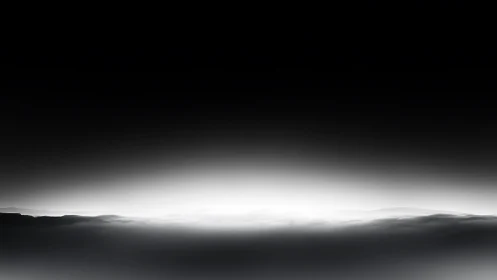 Monochrome atmospheric horizon dissolves into luminous void