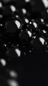 High contrast macro spheres explore glossy black surface