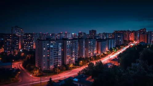 High-rise residential district at night with neon-lit arterial road