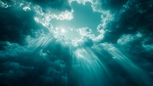 Radiant teal sunbeams piercing dramatic storm clouds.