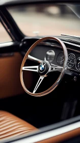 Timeless classic car wheel with warm leather interior.